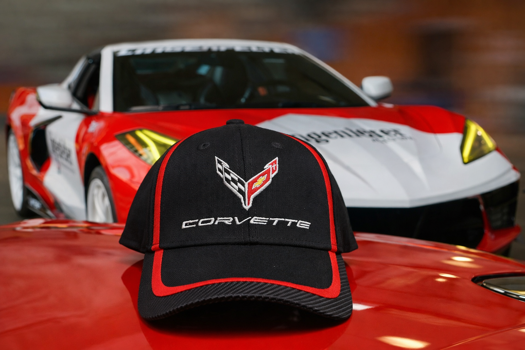 Corvette hat displayed on red C8 Corvette sports car
