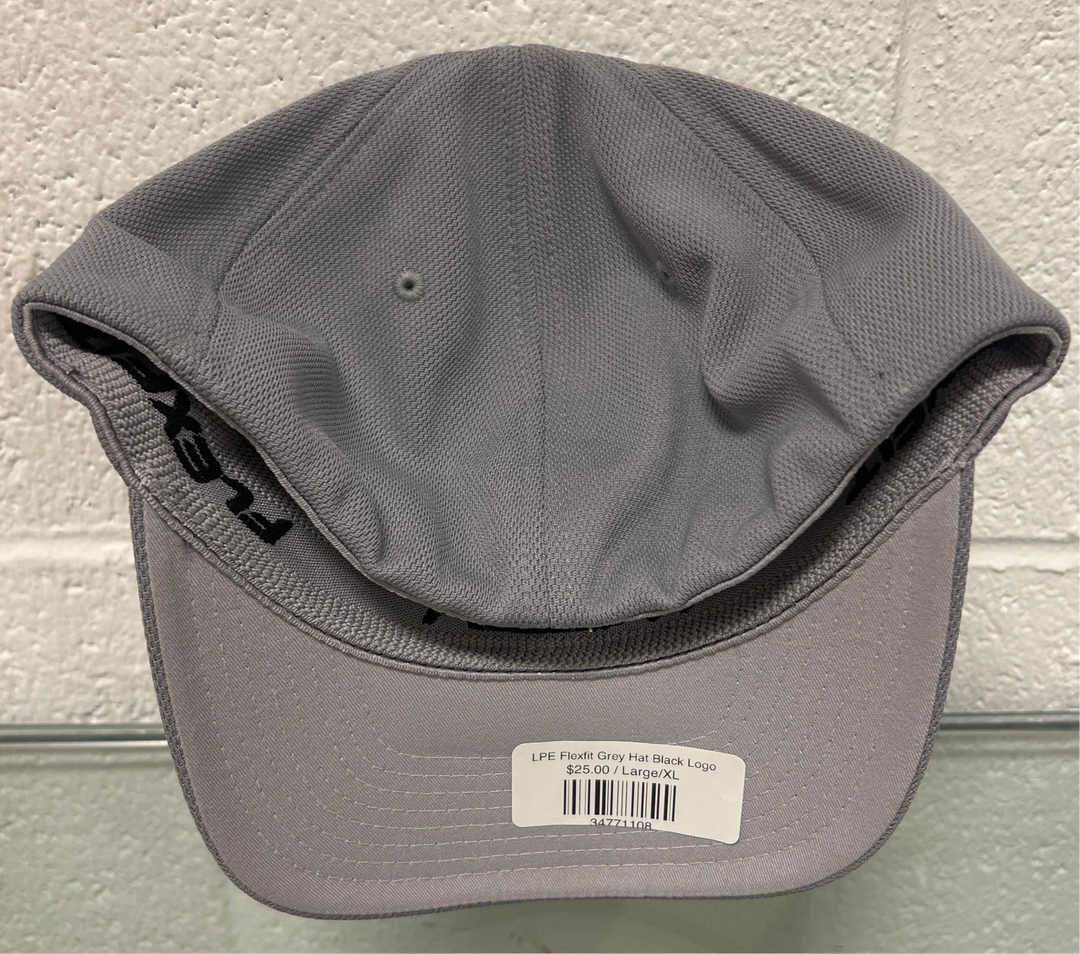 Gray cap with a brand label on a textured surface