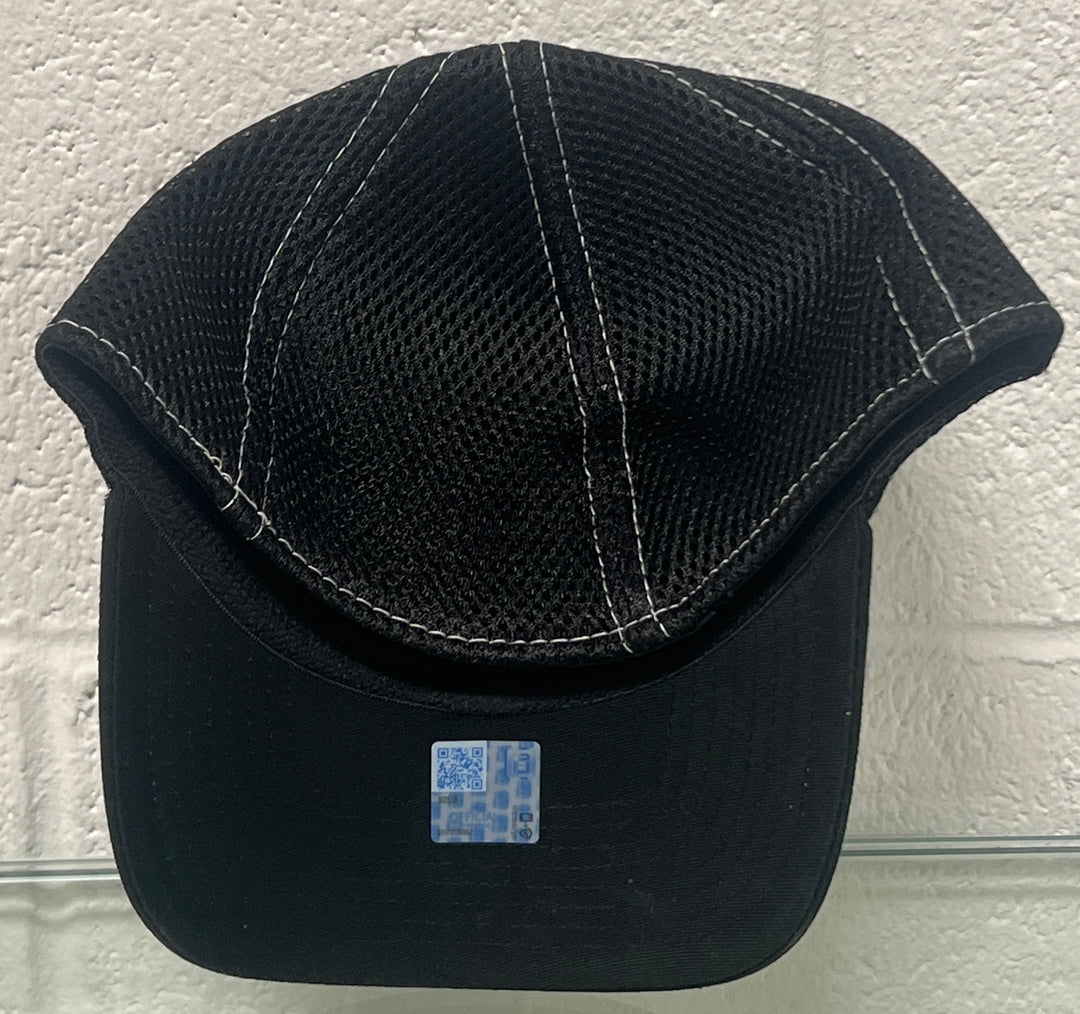 Black cap with mesh back on a textured white background
