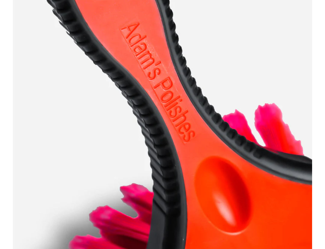 Team Lingenfelter Adam's Wheel Brush for cleaning car wheels, featuring durable bristles and a comfortable handle for detailed rim cleaning.