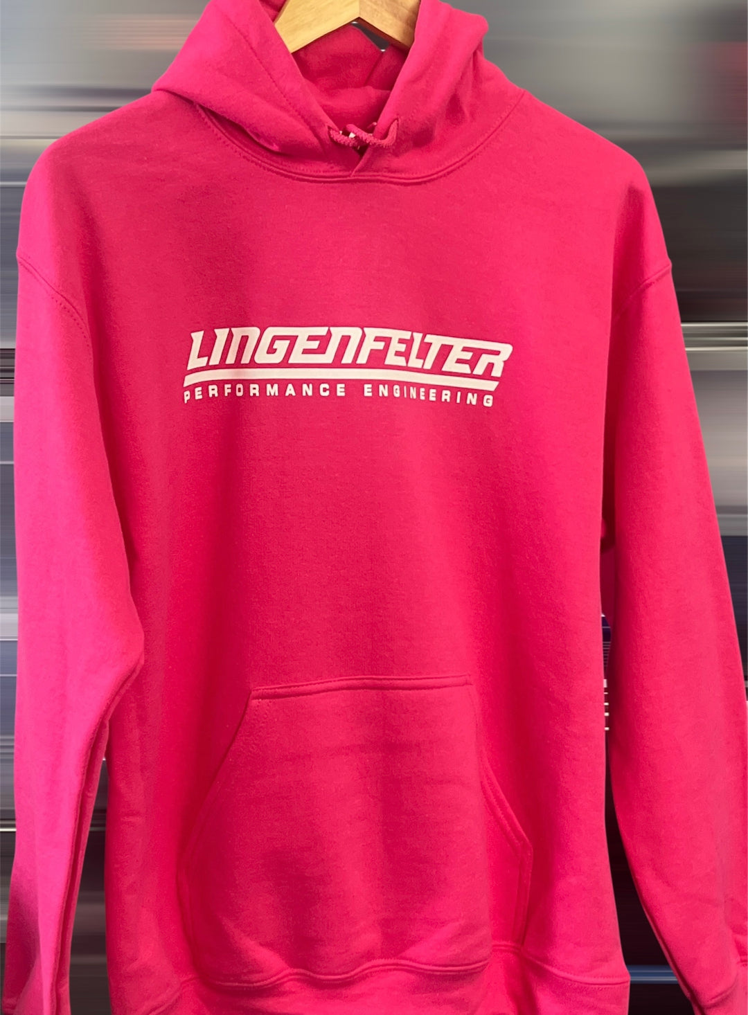 Red hoodie with 'Lingenfelter Performance Engineering' logo on a metallic surface.