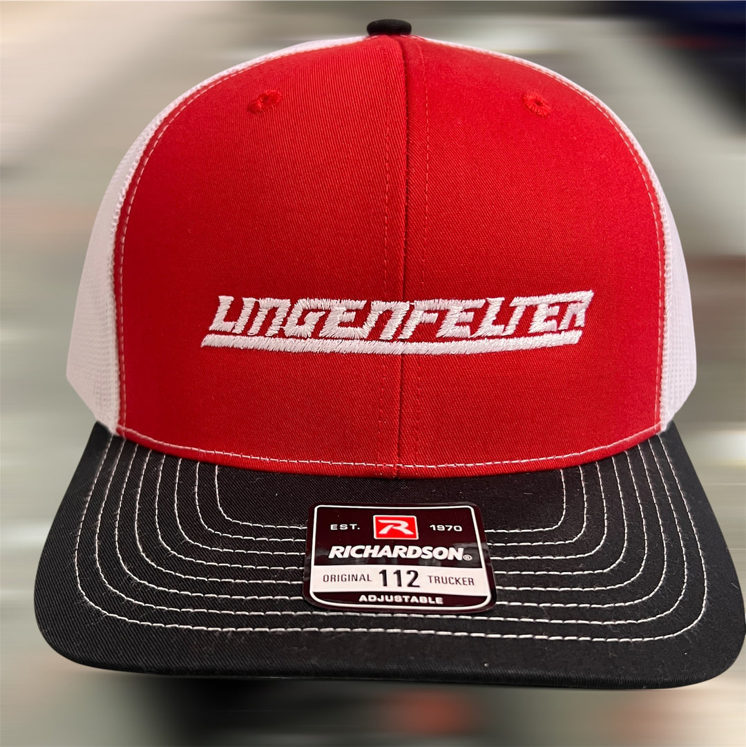 Red and black cap with 'Lingenfelter' logo on a blurred background