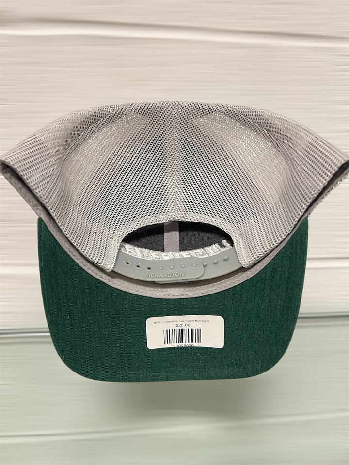 Green and gray cap with a brand label on a neutral background