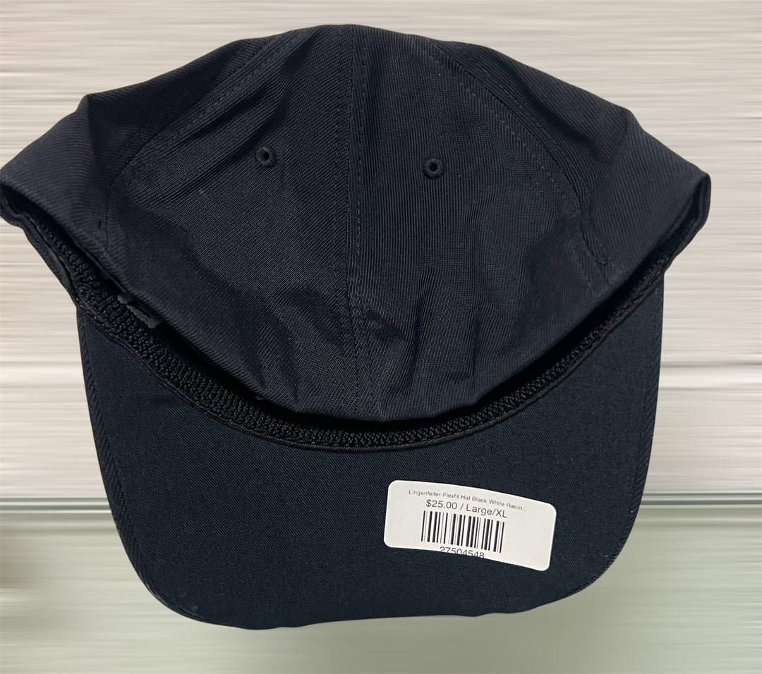 Black cap with a label on a neutral background