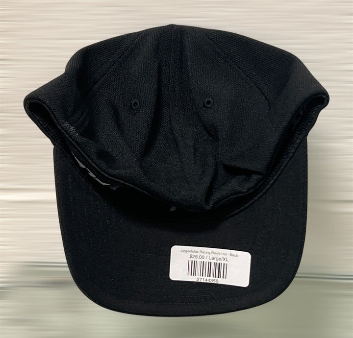 Black cap with a label on a light gray background