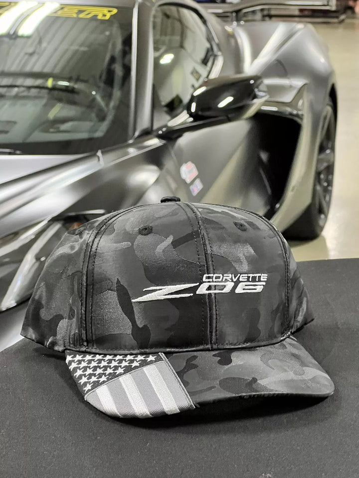 Black C8 Corvette Z06 Camo Flag hat by Lingenfelter Race Gear featuring a bold camouflage pattern and Corvette Z06 logo.