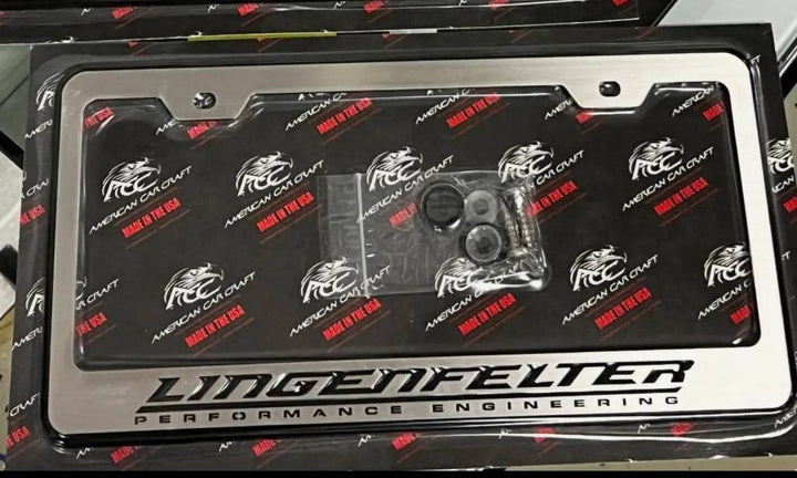 Black Lingenfelter license plate frame with black logo, made by American Car Craft, for custom car appearance.