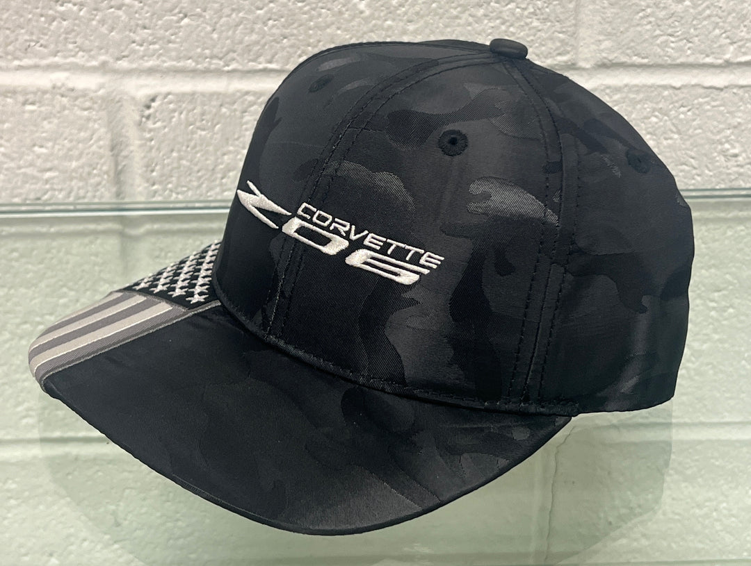 Side view of Lingenfelter Race Gear C8 Corvette Z06 camo flag black hat, showcasing the stylish design and branding.